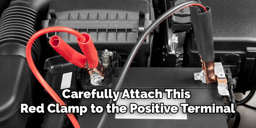 Carefully Attach This 
Red Clamp to the Positive Terminal