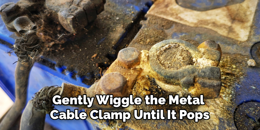 Gently Wiggle the Metal
Cable Clamp Until It Pops