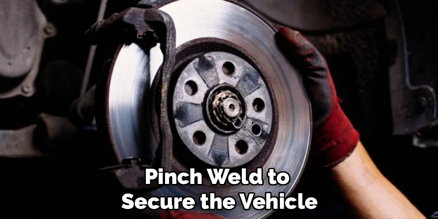 Pinch Weld to
Secure the Vehicle