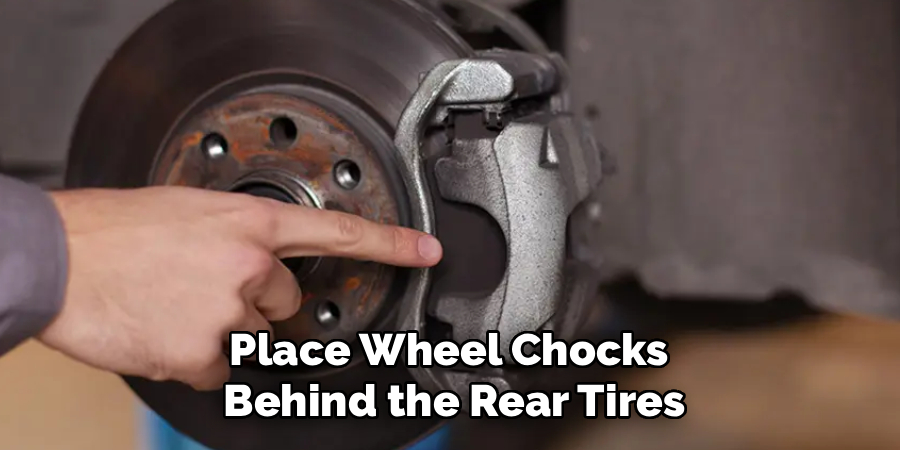 Place Wheel Chocks 
Behind the Rear Tires