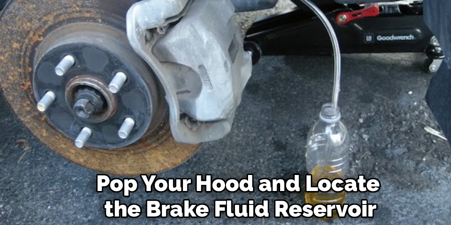 Pop Your Hood and Locate
the Brake Fluid Reservoir