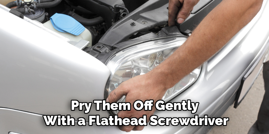 Pry Them Off Gently 
With a Flathead Screwdriver