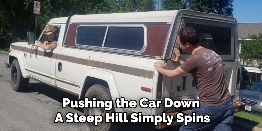 Pushing the Car Down 
A Steep Hill Simply Spins