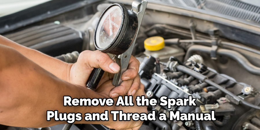 Remove All the Spark
Plugs and Thread a Manual