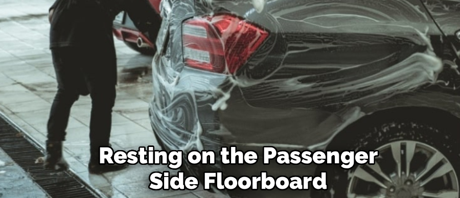 Resting on the Passenger
Side Floorboard