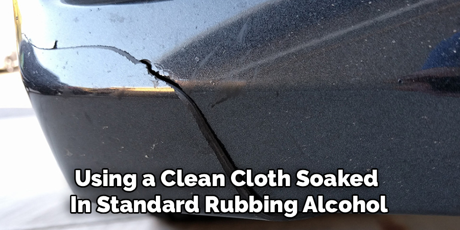 Using a Clean Cloth Soaked 
In Standard Rubbing Alcohol