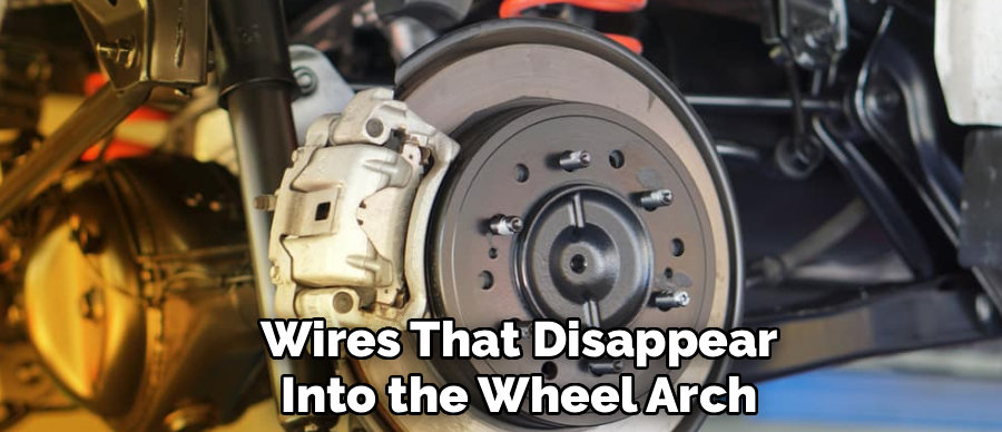 Wires That Disappear
Into the Wheel Arch
