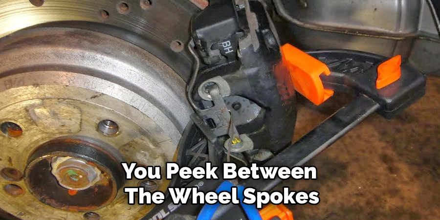 You Peek Between
The Wheel Spokes
